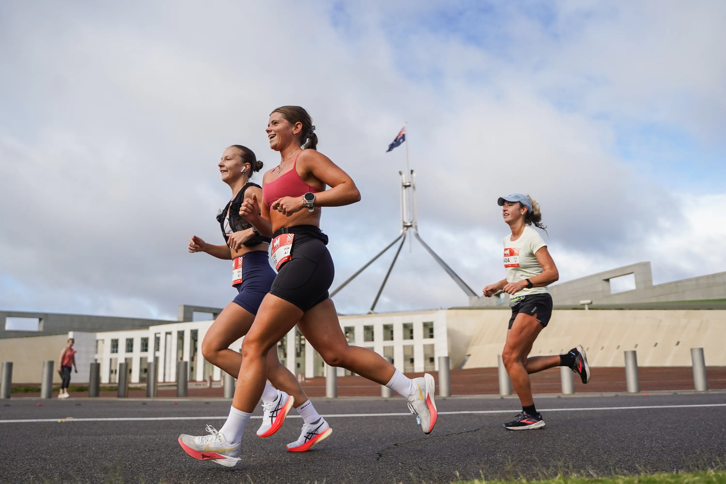 People exercising on a shared path near Parliament House in Canberra.