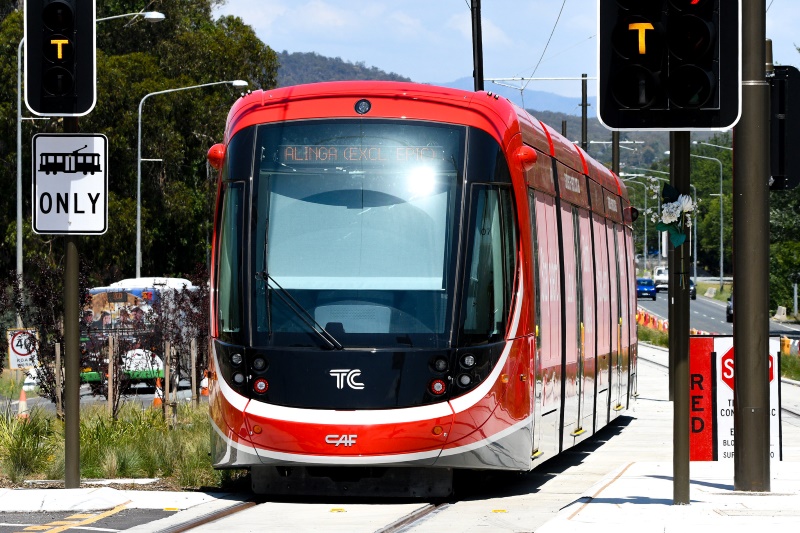 Transport Close up of Canberra light rail vehicle stopped at traffic light.
