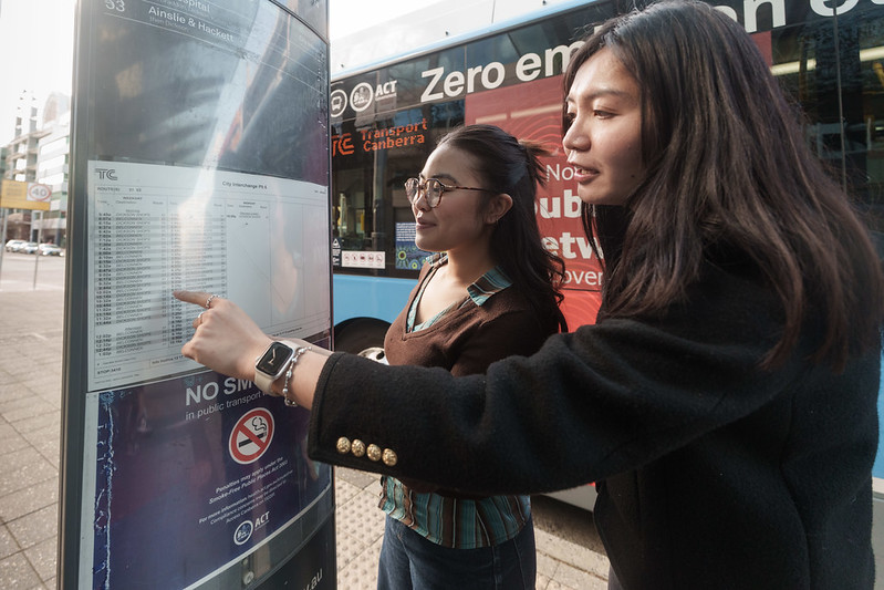 People looking at timetable