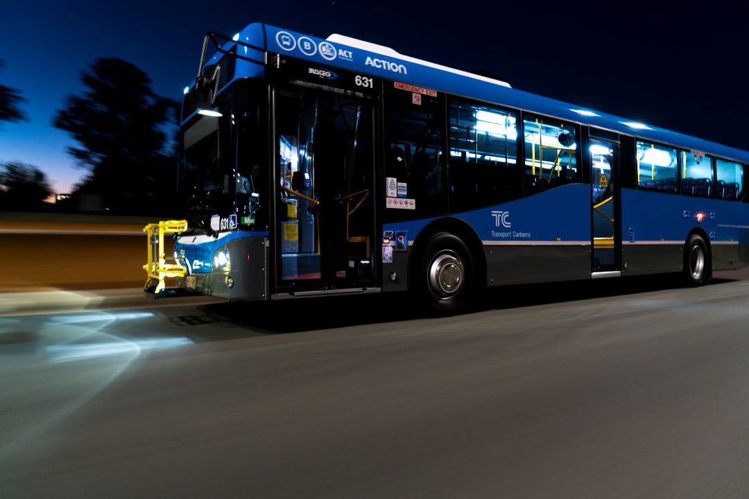 A blue bus operating 